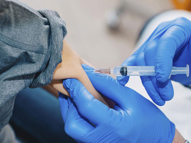 Child injecting with vitamin B12