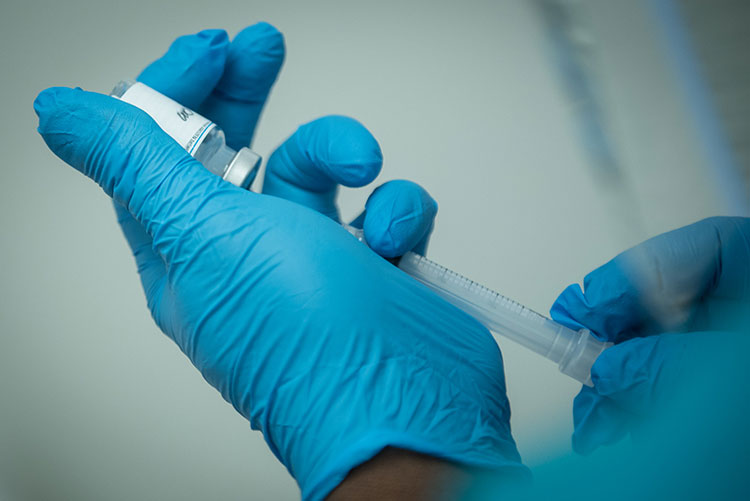 Person drawing insulin into injection