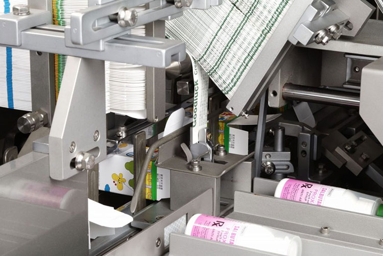 Spray bottle insertion into the carton by hot melt glue mechanism